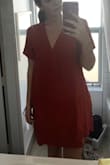 I love this dress and the color is beautiful. It is very obviously a smock dress so I think it is a little ridiculous if you purchase it and then complain about looking like a bag... but whatever. The fabric is very heavy and incredibly nice. I would say this is probably the nicest quality thing I have ordered from Lulus. My only complaint is that the dress is huge. I had to exchange it for a small, which honestly I think might still be too big. - Lillian W.