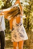 I wore this in my engagement photos. The color popped so much, which is what I was looking for. Beautiful dress! Plus the back is open and that makes it even cuter! - Hanna F.