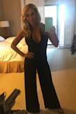 I ordered the small size first but it was way too small in the bust - the medium fit great and no hemming was needed on the pants. It is very low cut but I was fine with that. My only complaint is the back elastic portion was a little loose and I wish it zipped instead of having a cheaper looking elastic thin band. - Mendy R.