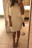 This dress gives all the right drama. I am using it for my rehearsal dinner, and felt like it was formal enough but also fun with a dramatic flare. It fit my hips perfectly (a small would have been too tight). The top is a little big on my short torso, but with some fashion tape to hold it where I want on my shoulders, I'll be just fine. I love the open back, and the material of the dress is perfect. Truly, such a flattering dress. - Katherine P.