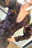 I was so excited to use this as a Christmas dress, but when it arrived I was immediately disappointed. The color is more of a brown color than a "plum purple" or red like it looks in the Lulu's picture. Additionally the dress is loose everywhere, there are about 15 buttons, zippers, clasps you have to undo and redo to put it on. The sleeves also have a weird pucker shoulder design, and combined with the velvet mesh material, it doesn't look good. Returning. Don't waste your money. - Jacquelyn S.