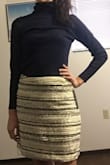 Have yet to wear it but I LOVE the material. Very high quality!! Worth the price. It has a liner inside which is great! It isn't too short either which I love as well! Overall, very satisfied! - Jessica B.
