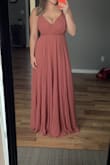 I ordered this dress for my sisters wedding and I absolutely love it.
There is a small pull in the dress which is fine, but just need to make sure it doesn't get any bigger, before the wedding date.
I ordered an XL after following the size guide to ensure there was enough length on the dress for me. It is a good thing I did as it is a little snug on the chest area, but it does fit.
I live in Canada so price is is a little more with the USD conversion as well as boarder customs.
Overall extremely satisfied with this purchase! - Rachael L.