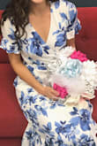 Wore this dress for my bridal shower and loved it! I typically wear a size small but was able to get away with ordering a size down since it was a wrap dress. Plenty of room in the arms and was not constricting at all. Good length with short heels. Got LOTS of compliments and overall am very happy with this purchase! - Danyelle F.