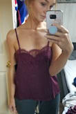 THIS SHIRT IS GORGEOUS! I ordered my usual small and it's not large at all. I'm slightly petite with a short torso and I found this was very flattering. Not boxy at all on me. The burgundy is beautiful in person. Thin but not sheer. Looks expensive. I can't wait to wear it! - Allison