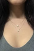Lovely necklace! Gold quality chain and has a great sparkle. 
Photo shows the necklace hooked on its last link, the longest the necklace will wear. - Cadence L.
