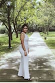I wore this dress for my pre-wedding photo shoot. It fit true to size for my body, and the fabric is soft and flexible. I got a lot of compliments about this dress. - Chomphunut K.