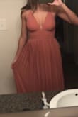 Got this dress as a bridesmaid dress. It's so pretty. The color is gorgeous and the fit is very flattering. The chest does cut down pretty deep, which I was worried about wearing to a wedding... but the cleavage isn't too bad! Hope I can wear it again in the future. Might need to be hemmed for somebody who is on the shorter side. - Sadie H.