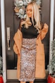 I'm literally obsessed with this skirt. You can dress it up with heels and a nice blouse, or dress it down with sneakers and a t-shirt. The cut is extremely flattering. I would recommend sizing a whole size down. I ordered a medium but needed to take the waist in a few inches. - Jessica W.