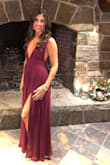 Loved this dress. Wore it to a Winter wedding and received a ton of compliments! I love plunging necklines, it was form fitting but yet elegant on the top. I don't need any support so be careful if you have a bigger bust and need a bra. The back is also low cut. I would agree with the other reviews that the skirt needs to be hemmed for most women-I'm 5' 7" and about 3" dragged on the floor (with no shoes) before it was hemmed. - Eden N.