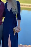 I ordered this for a November outdoor wedding. I thought what will look good and flattering, but keep me somewhat covered - this was it! Wrap dresses look good on everyone and being that this is a true wrap dress you can adjust the leg slit/cleavage to your liking. I only had to be careful sitting down/crossing my legs so that it wouldn't completely fall open. The only downside was I wish it was longer. It only hit the top of my ankles without heels, but then again I'm tall. It was the perfect combination of sexy and subtle. I got so many compliments. - Delaney S.