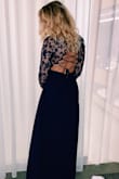 I bought this dress for the back of it and loved it. It is definitely long (but not too long) and I am tall. Also, getting the dress on/off isn't the easiest but it's worth it! - Peighton S.