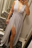 The dress is made very well and flows beautifully. Typically I am an XS/S or 0/2 depending on brand.  I ordered two different colors, and the sizing ran slightly different. The XS in the purple was slightly tighter and longer than XS in grey. Ultimately I kept the grey XS and it fits me perfectly with no alterations (wore 3-4" heels which ensured the perfect length). - Christine S.
