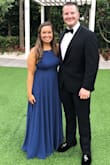 Fits true to size. It is long, but I'm also short, so I just had to get it hemmed and then it was perfect! The material is wonderful. I wore this to a wedding and got so many compliments. - Holli H.
