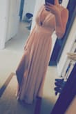I accidentally ordered this dress a bit too small but when I got it it actually ended up fitting perfectly. I bought it to wear as a bridesmaids dress to my best friends wedding. The color is perfect and I love the material of it. I can't wait to wear it at the wedding! - Nicki R.