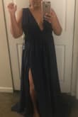 I originally wanted the red but it still has not been restocked. I opted for the navy blue and I was so nervous about the size and color not really working for me but once the dresses arrived and I tried it on.... omg I fell in love. It's so free flowy (exactly what I wanted) and the material is thick so it's perfect. I cannot wait for my engagement session. I normally wear XL in dresses and was pleased when it fit. I will have to get it hemmed though, I figured as much because I am short lol. The waist is definitely snug so there isn't much wiggle room at all. This was my first order from Lulus and I will certainly be ordering more. - Tarniece R.