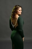I purchased this dress for a photo shoot! It definitely delivered! My back is one of my favorite features! I'm an athletic build with broad shoulders this dress has enough stretch that it fit my curves and muscles perfectly! - Kat S.