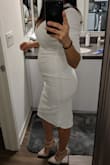 I'm 5 months pregnant and I refuse to buy maternity clothes. I was looking for a nice daytime dress for a graduation. I typically wear a size Small in Lulu's when I'm not pregnant, so I still ordered a Small because it said that the waist was stretchy and allowed for a custom fit. It fit great! The fabric was nice and thick so as to not be see-through. I did find that the neck was a little too low cut for my comfort, but my DDs are swollen so, there's not much I can do to hide them. - Amanda V.