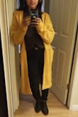 I'm on the shorter side, so I had to hem it 8 inches for it to fit properly. If you don't want to hem it and are short like me, you'll want to wear heels. It is 4' long from the collar to the bottom. I've added a photo - I hemmed it myself so it is a bit uneven! - Urmi B.