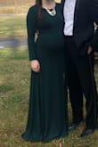 Bought this dress to wear to a fancy winter wedding. I'm 6 months pregnant and this dress was the perfect thing to wear! It was stretchy and clung to my curves in all the right ways. I did order a Small and a Medium but stuck with the Medium. The Small fit, but I didn't want it to be obscenely tight over my bust and bump. You probably will want to wear a smoothing garment underneath. I did have the dress hemmed about a 1.5 inches and wore it with 2.5 inch heels and after all that it was the perfect length for a shortie like me. Also folded up the sleeves a little but you can also push them up. The slit came up high but not too high - just perfect! Highly recommend this dress!! - Lindsay B.