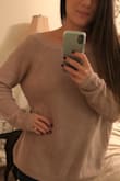 The material of this sweater is good quality, and it is very comfortable. I love the back of it too! Perfect for a chilly night out! The medium was perfect, a little loose, but it that is how I wanted it to fit. - Hilary S.