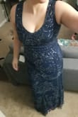 I ordered an x-large and it's a tad small, but not super uncomfortable. I was a little worried about the length in heels, and although it's not as long as I prefer with heels on, it works! I bought a 1.5" heel and while I can tell the difference, others can't. My only complaint is the zipper gets caught really easily. My husband had to help zip me up, but once we got it about 3/4 of the way done it was fine. It was like that off the hanger as well. There are a few frays in the tulle beading, but pretty good quality for the price. - Jennifer S.