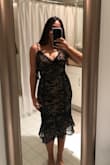 I got this for NYE but I might return it for something more sparkly lol, but this dress is beautiful!! Really elegant and can be worn formally or for an occasion. I ordered a Medium since everyone said a small runs small, and it fit perfectly. Around the calves it doesn't stretch! And I feel like the lighter part under the lace isn't as beige as it is in the picture. It's slightly darker. Overall - so pretty - Isabel C.