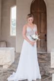 I purchased this dress for my wedding and I could not have been happier! It is even more gorgeous in person than in the photo and the intricate bead work makes it look like it came from a high end boutique. I am blown away by how perfect this dress worked for my special day. It was just slightly big on me, so I did take it to get tailored. The bottom skirt half is also pretty sheer, so I did get a solid slip to wear underneath. Thank you Lulus! - JoAnne Q.