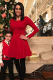 I purchased the XS and it fits perfectly. I like my clothes to look fitted. Perfect dress for a holiday. - Taina M.