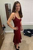 Stunning dress for a holiday party. I was a little self conscious about the low neckline and tight tummy and could have sized up to a small as I was in between sizes. Good quality fabric and had a short liner. It looks like the emoji red dress girl. Definitely recommend it. - Brooke G.