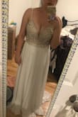 This is such a beautiful dress. The beading on it is so detailed. I do have to get it hemmed since I'm short! Also need to make some adjustments to the back because if I don't stand straight it droops down a tad but other than that completely worth it! - Annette M.