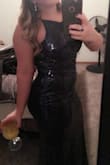 Wore this to a military ball, I was a little nervous after reading the reviews about it running a little small and it being a little long. When I got it out of the bag it looked really long so I was nervous but as soon as I put it on the dress fit perfectly. I have a bigger booty and the dress fit me like a glove. If I had more time to prepare I would have wore spanks because if you have a little tummy it shows a little. With having curves it actually shortened the dress on me and I could actually gather material at my waist and it stayed unless I purposely pulled it down. I was worried about the sequins bothering me but really just the zipper on the side irritates me a little and I honestly didn't notice it after awhile. I got compliments all night on this dress and felt classy but still sexy. - Kayleigh S.