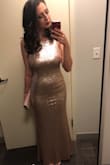 This dress is absolutely beautiful on! It fits really well and I received tons of compliments on it! Worth the purchase. - Lauren