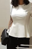 The material is good, doesn't feel cheap. Elastic and very comfortable. It's feminine. I love this top. - Diego S.