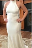 I wasn't sure how flattering this dress would be on me, but it's fantastic! It does fit big and is very stretchy, I'm pretty much always a large but I wish I would have got the medium - it's especially roomy in the bust. But simple alterations will fix that! It's a comfortable thick but very stretchy fabric, has some light boning on the sides and the seams create an hourglass silhouette even though I'm not curvy at all! I can't wait to wear this for my elopement ceremony coming up!! My advice would just be to size down. :) - Breeann M.