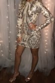 As soon as I saw this dress, I knew I needed it for my sorority formal. I originally ordered it in a Medium and it was very big! I'm 5'7" 135 lbs. So I ordered the Small and when it came in, I could not be happier! So many compliments!!!! - Brittany H.