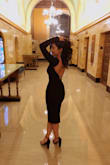 I bought this dress for a work holiday party. Everyone kept complimenting me throughout the night. The quality feels thick enough to hide lumps etc. It's stretchy enough for bigger chest sizes. The back was just the best part, it stood in place didn't have any issues with it moving to the sides. Totally recommend this dress, it can be dressed up or down depending on the occasion. It's modest with a sexy touch to it. I didn't have to wear a bra the material is sturdy enough to hold the bust in place. - Genesis R.