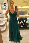 Loved this dress for a wedding in Jamaica. It's got a double layer of fabric which feels high quality and luxurious. The dress is flowy and fun to dance in. I got so many compliments throughout the night. The color is deep forest green. I wore it with nude heels, but switched to black flip flops halfway through! It's got a high-low hemline, and dragged on the floor when I switched to flats. I'm 5'7", so shorter people will have to wear heels with this one. - Shannon M.