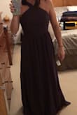 I bought this for my cousins wedding that I am a bridesmaid in and it fits perfectly! It could potentially need hemmed as I am not super tall but honestly if you're wearing heels in this dress it should be fine (we are wearing flats). I was surprised (but happy) that the material isn't elastic-y as it looks in the picture, it's more of a net/flowy material for a lack of a better word? It's beautiful though and I am very happy with it! - Emily C.