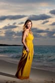 Purchased for photos on the beach. I was very nervous about buying yellow (usually washes me out), but it was perfect and I received several compliments. Fit is true to size. If I wasn't in my mid 30's, I probably could have gone braless, but I had a strapless that worked. - Melissa S.