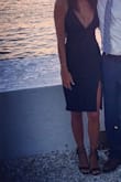 I loved loved rocking this dress At the end of the summer. I'm a tall gal and my legs already look long so I did stitch the slit closed a bit....! It's still pretty high. You are only young once - buy it! - Rebecca R.