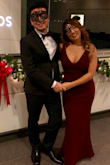 I wore this dress for my company holiday party and it was absolutely perfect! I got SO MANY compliments that night. I initially got medium because I was worries about the fit in the chest but it was too loose on me so I returned it. I exchanged to size small (this is my usual size) and it was perfect! The dress has some stretch to it and hugs the right places, although it won't hide your tummy that much. I love the simple V neck/back line and flare at the bottom! 
I paired the dress with black strap heels (about 4 inches) and it was perfect. I did have to alter the dress a bit, taking in a few inches on the bottom and shortening the strap a bit for my 5'4" frame. If you are tall like 5'7", probably this dress will be perfect for you with some heels. - Sein W.