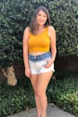 I am usually a size M in shirts, but since I knew this was a tight fitting crop top and I have a bigger chest I ordered a L. It is still very cropped, but I LOVE it!! I wear it so much, it's very flattering and comfortable and I wear it with no bra (even better). It's great with shorts and even jeans and a denim jacket with ankle booties! - Kami C.