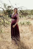 I wore this for my maternity pictures and it was still a little loose. We made it work though and I received tons of compliments on this dress. Very long and thick with an under layer. - Tiffany C.