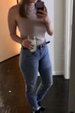This shirt was amazing has a double layer in the front so it isn't see through. The razor back is a little deeper than I expected, but still cute. Overall great shirt and perfect for a causal outfit or night out. - Alexis J.