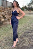 I love this jumpsuit and think it was a great deal for the price. The princess seams make it look expensive. I wore it to a wedding and got lots of compliments. I do think it runs large. I'm usually a medium in bottoms but this medium was way too big. I returned it and got the small which fit much better. I still took in the bodice, but I have a very small chest. - Katie V.