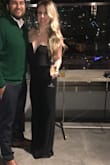 The V can be a little deep if you have a larger chest. Even wearing very high heels I was still walking on the bottom of the pants so I had to have it hemmed. I still love it though! - Erin M.
