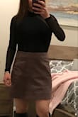 I'm pretty short, just under 5ft without heels, so this bodysuit runs a little long. I normally get an XS in bodysuits from Lulus, but read the reviews and went with a small because of the tight squeeze through the opening for the head. Overall LOVE the look and have received many compliments. :) Paired it with a mauve leather skirt also from Lulus and a pair of knee high boots. :) - Linda R.