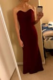 It's a tight fitting dress, which is ideal for someone with a pretty straight, slim body shape. It goes in at all the right spots and the fabric is nice & heavy (a good contrast given that the dress does not have straps). Love the color and design. - Esther K.