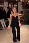 I was looking for a jumpsuit for my company's holiday party. This fit perfectly! I ordered the extra small as I wanted it to hug my booty and squish the girls together a bit. I wore a thinly lined strapless bra and it didn't disappoint. I love the fabric as it's thick and hugs my body well. HIGHLY recommend. Can't wait to wear this again with different accessories to spice it up. - Mary S.